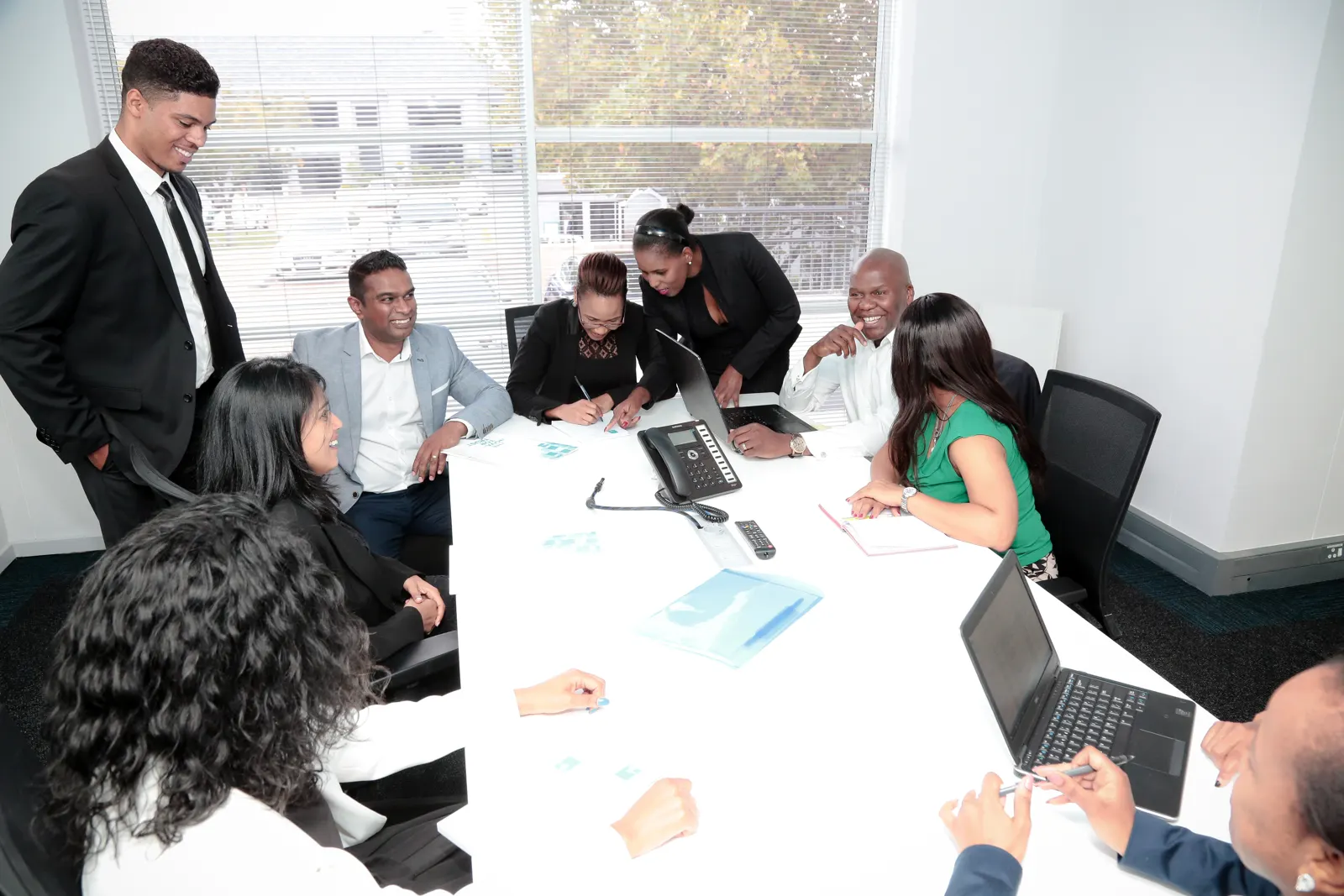 Neil leading a session at the head of a boardroom table