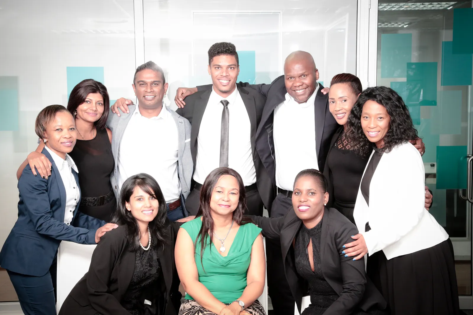 Neil with his team in an office
